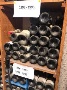 Old dusty bottles of wine from 1995 to 1996