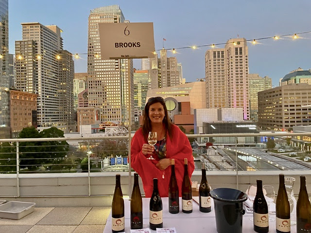 Janie pouring wine at the Wine and Spirits top 100 tasting