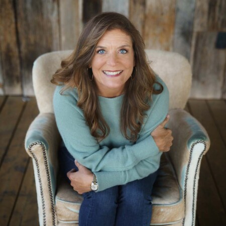 Janie sitting in comfy chair on Brooks Patio