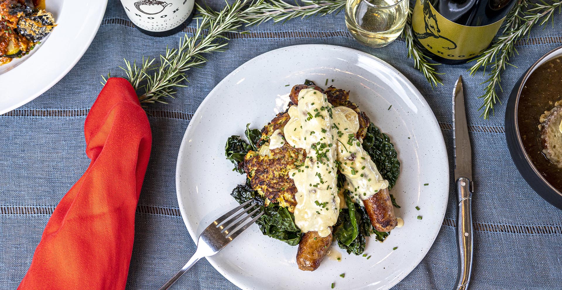 Seared Italian sausages with garlic braised kale & sweet potato latke