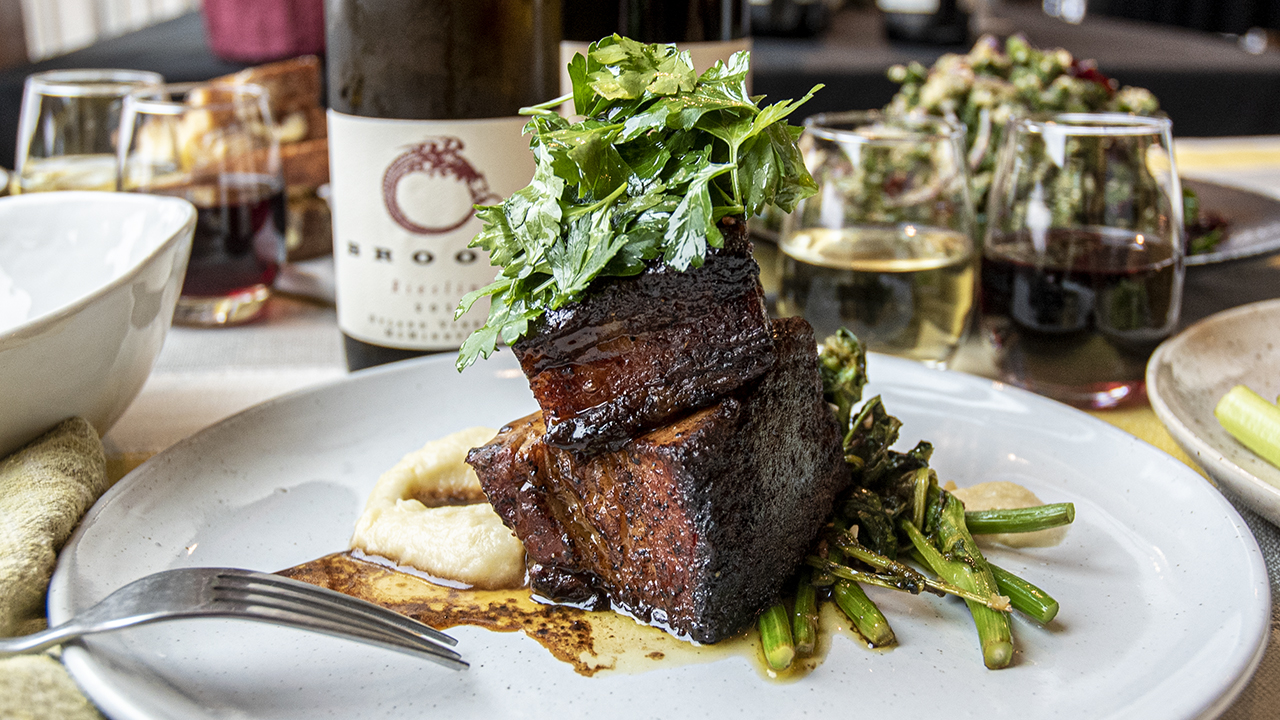 Crispy pork belly with rapini and an apple puree